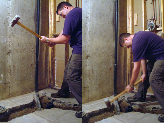 Matt breaking the concrete floor in our basement bathroom