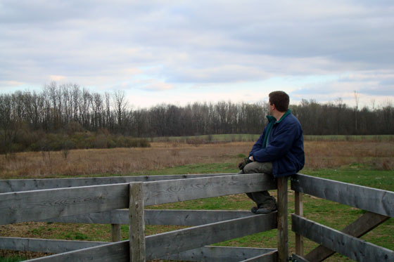 Matt sitting on a fence