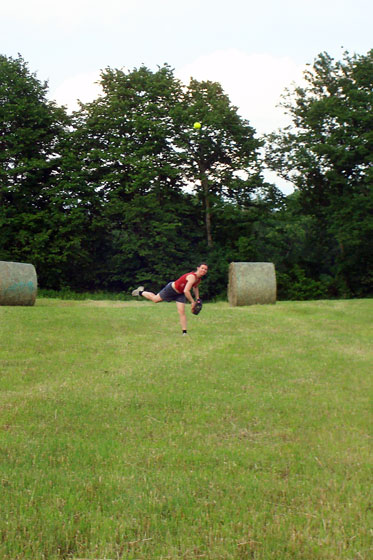 Playing baseball in the hayfield