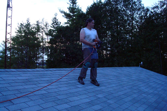 roofday3a Matt on the freshly shingled roof