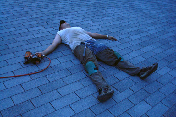 roofday3b Matt laying on the roof