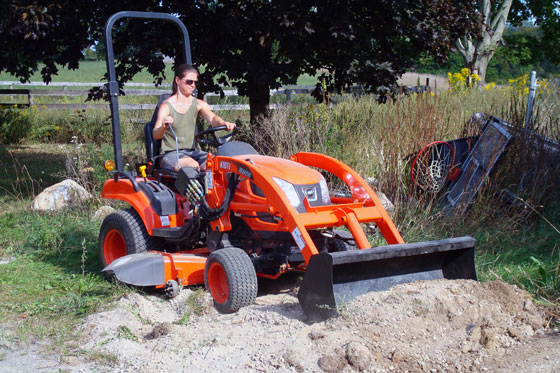 Backfilling a trench with Kioti CS2410