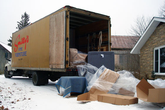 Unloading couch from delivery truck