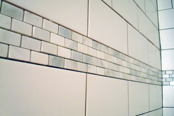 Carrera marble tile accent band