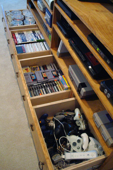 Drawers in a TV cabinet for video games