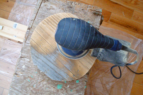 Removing a weathered finish from wood with a sander