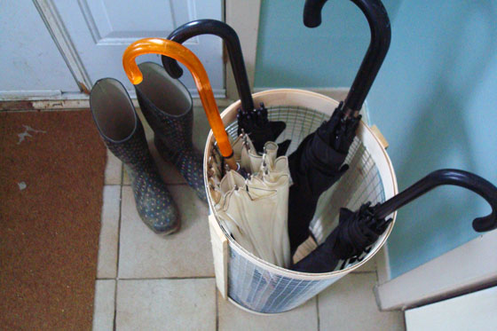 Rustic wood and wire mesh umbrella stand