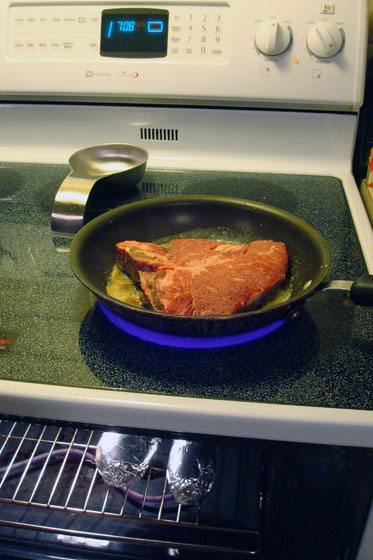 Cooking steak and potatoes on the stove