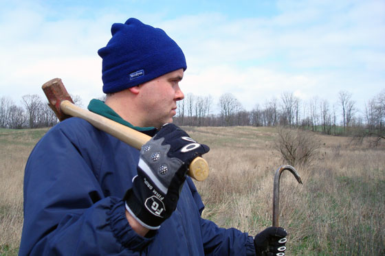 Matt prepares to do battle with a fallen tree with a sledgehammer and wrecking bar