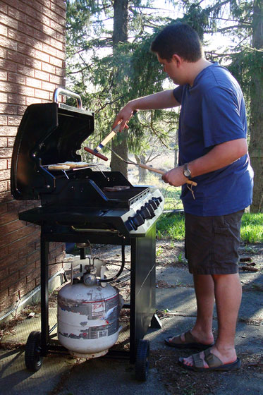 Barbecuing hotdogs and hamburgers
