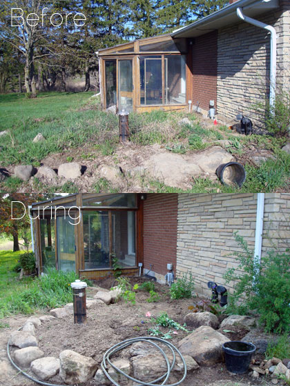 Rock edged flower garden around a well head