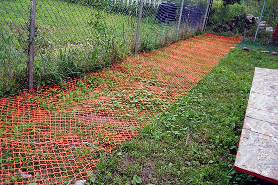Mesh fencing laid flat on the ground