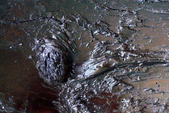 Knot hole in a rustic wooden bench