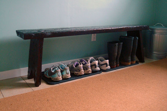Rustic wood bench in a mudroom