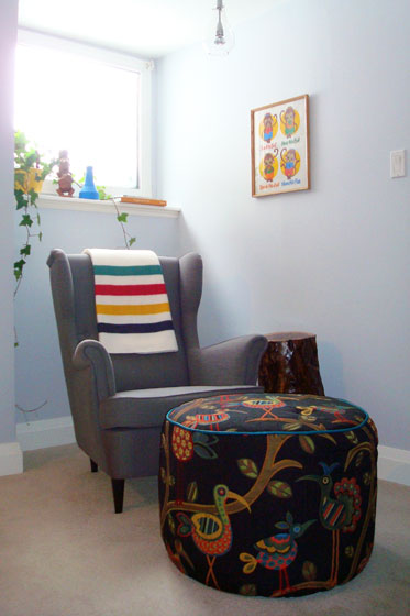 Colourful reading nook featuring Ikea Strandmon wing chair