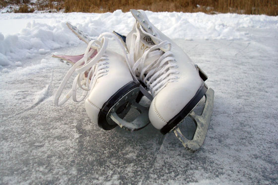Ice skates on a frozen pond