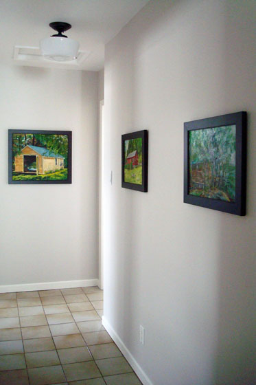 Paintings hung in the hallway