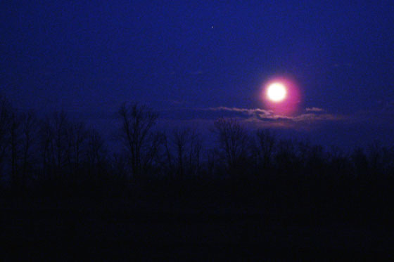 Full moon over country fields
