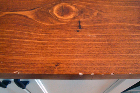 Chips in the edge of a wood counter