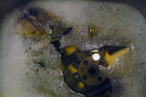 Washing the oil off of pipe fittings