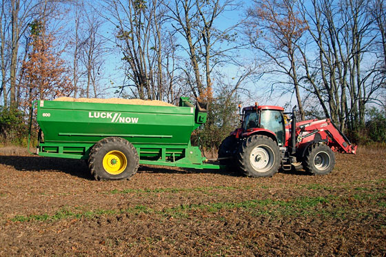 Tractor towing a trailer full of soybeans