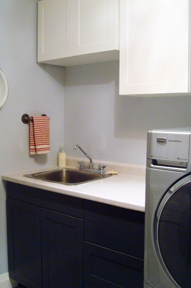 Black and white shaker cabinets in the laundry room
