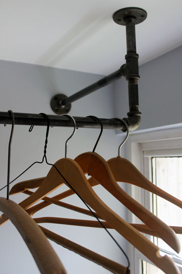 Vintage wood hanngers on a hanging rack