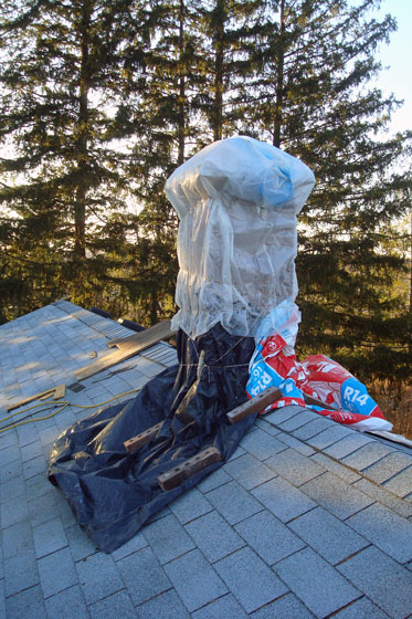 Chimney wrapped in plastic