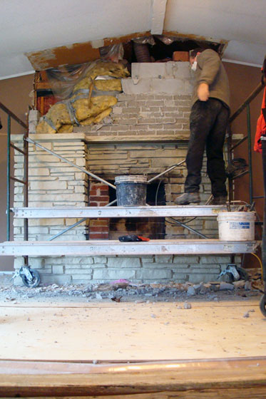 Demolishing the fireplace