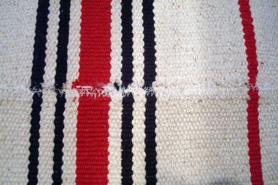 Three Ikea Signe rugs made into a runner in the laundry room