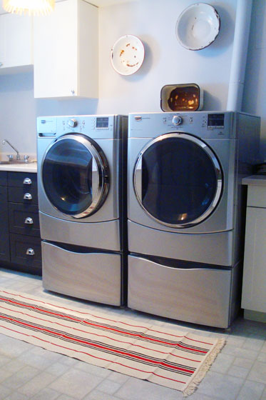 Three Ikea Signe rugs made into a runner in the laundry room