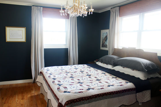 Dropcloth curtains in a navy master bedroom