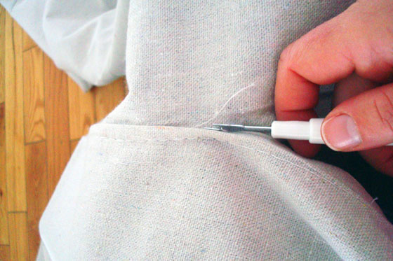 Ripping out the seam on a dropcloth