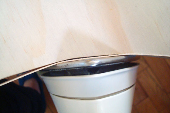 Applying preglued veneer edging to a curve