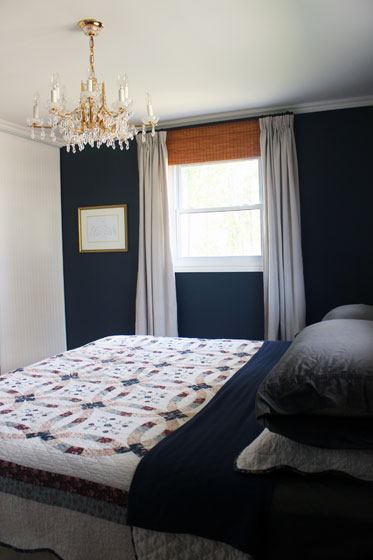 Blackout blind, bamboo blind and drop cloth curtain window treatments