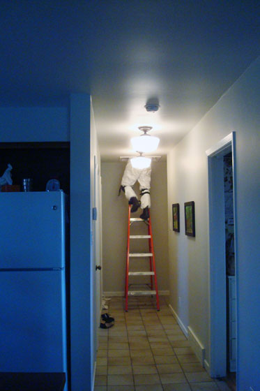Electrician going into the attic