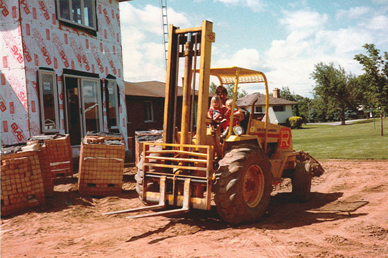 Riding the forklift with my Dad