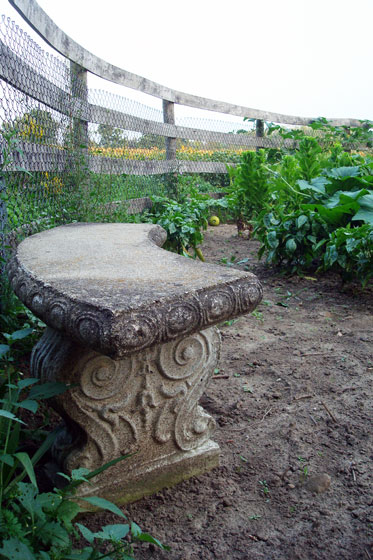Stone bench in the vegetable garden