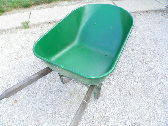 Green painted wheelbarrow