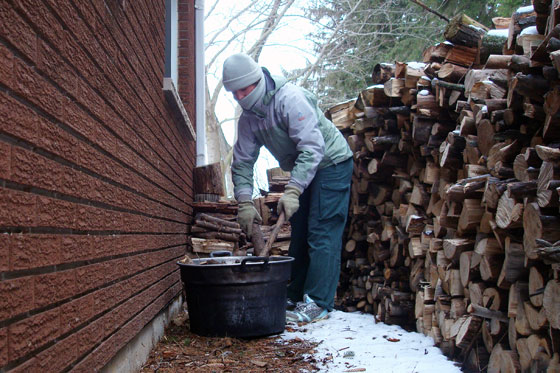 Loading firewood into the washtub