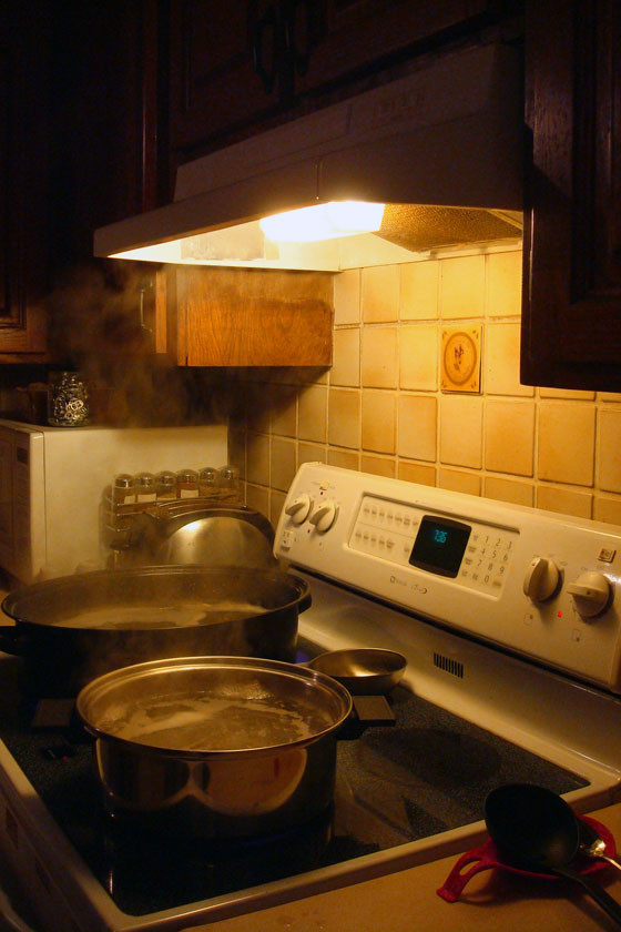 Boiling sap on the stove to make maple syrup