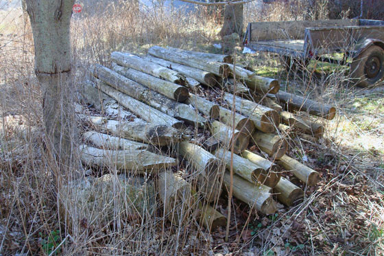Pile of old wood fenceposts