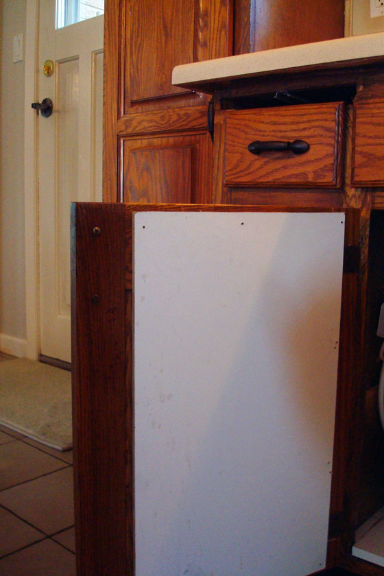 Holding a kitchen cabinet together with hardboard
