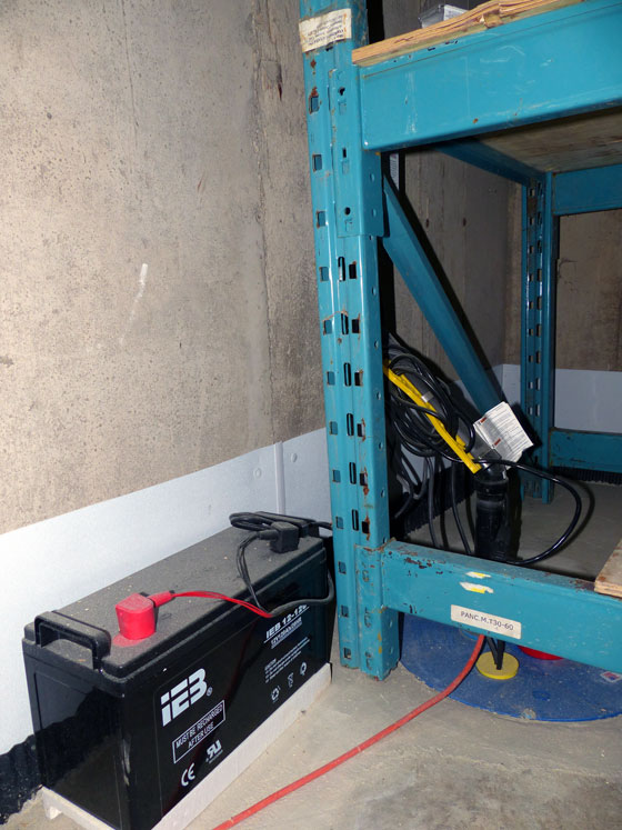 Back up sump pump powered by a marine battery