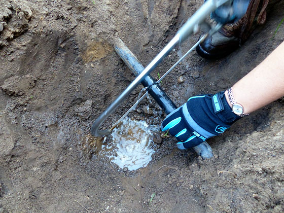 Cutting a waterline with a hacksaw