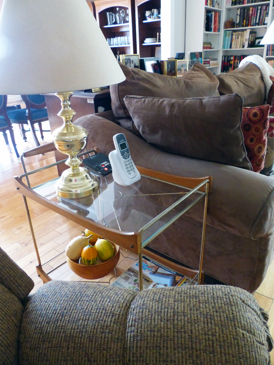 Vintage bar cart used as an end table in the living room