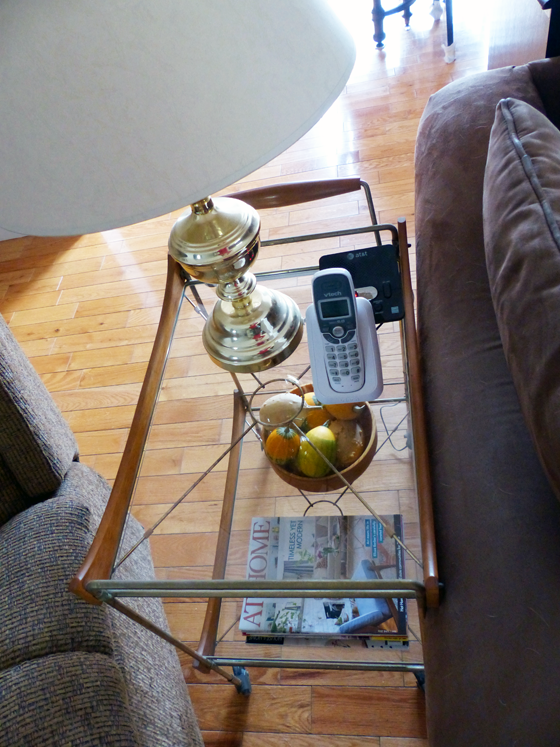 Vintage bar cart used as an end table in the living room