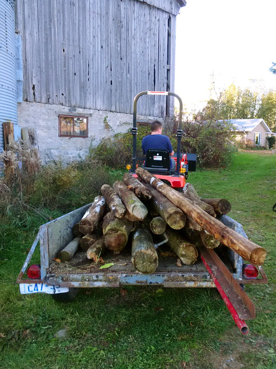 Trailer loaded with old fence posts