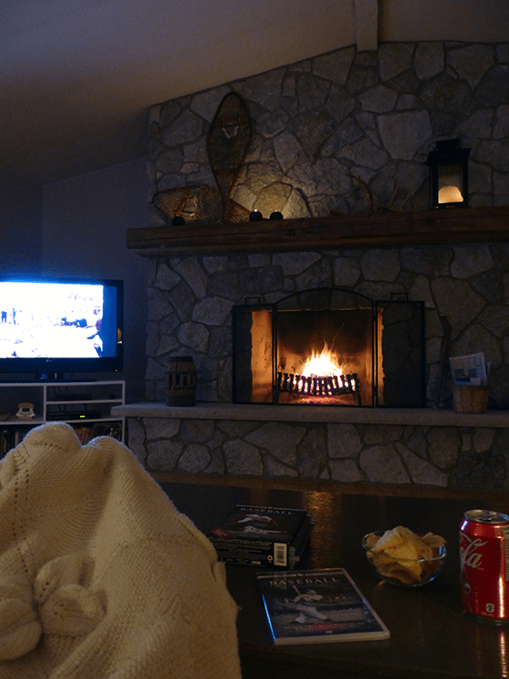 Cozy night in the living room in front of the fireplace