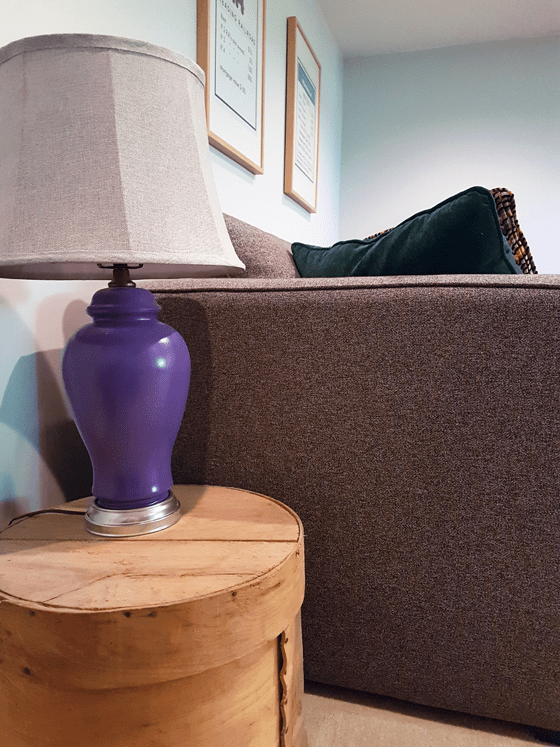 Purple lamp on a wood drum